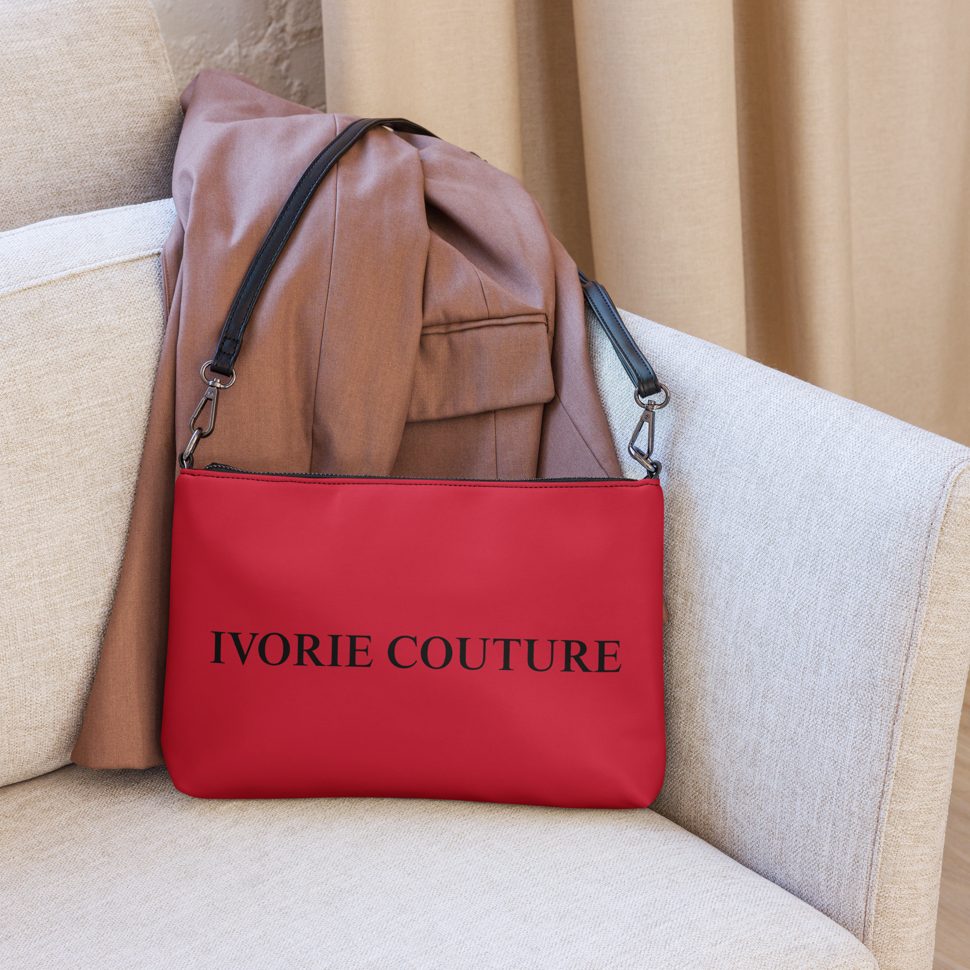 Riches Couture Crimsona Crossbody bag purse red on couch with clothing article